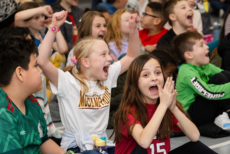 Students at Remington Elementary in D49 celebrate at a school assembly.