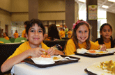 Photo of children in cafeteria to represent free school meal eligibility guidelines