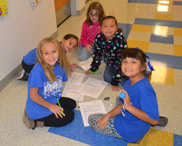 Second graders work on a science project at Las Animas Elementary School, which is led by a principal who is a strong believer in Colorado state standards. 