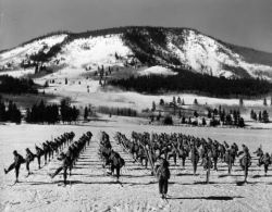 Picturesque black and white photo of the early days of ski training. 