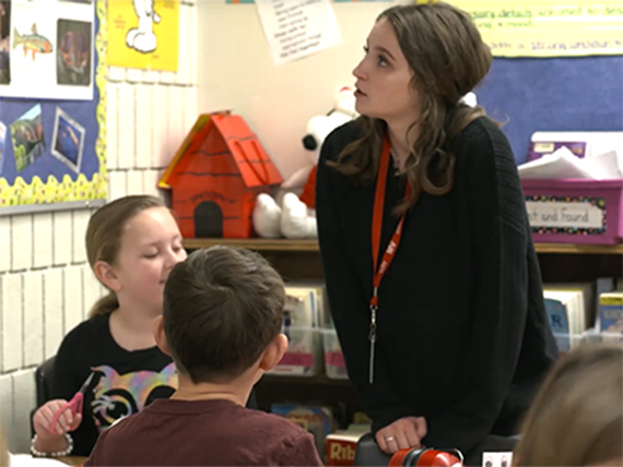 Teacher and students in a classroom at Littleton Public Schools 