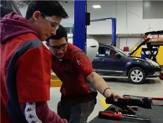 Student learning to work on cars for his ICAP