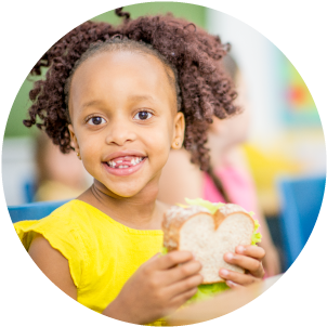 Photo of child with sandwich 