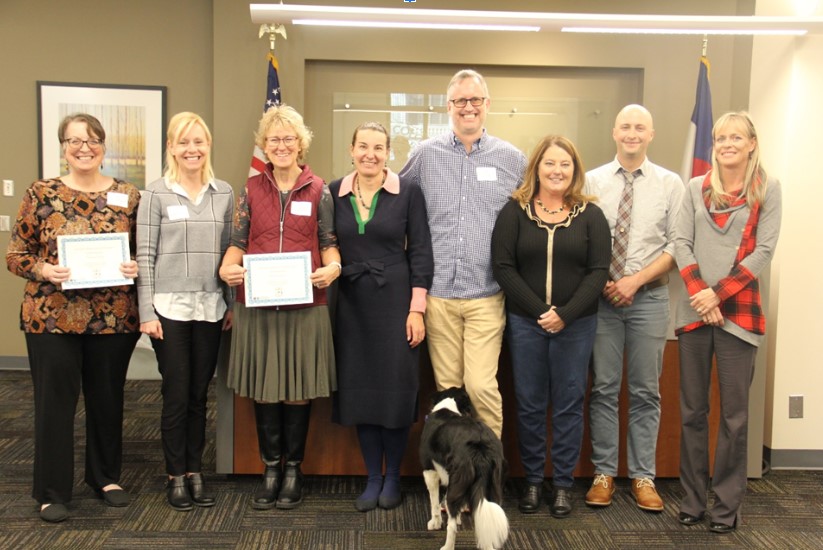 Photo from the November 2022 Teacher Cabinet meeting. Featured in the photo are from left, Carina Raetz, Hilary Wimmer, Bonnie Grover, Commissioner Katy Anthes, (Twila the dog), Kenneth Benson, Julie Sale, Scott Hicks, Lacey Taschdjian.