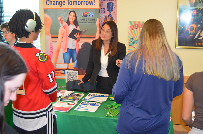 CDE's Heather Grantham talks to students at a recent job fair at Aurora's Rangeview High School.