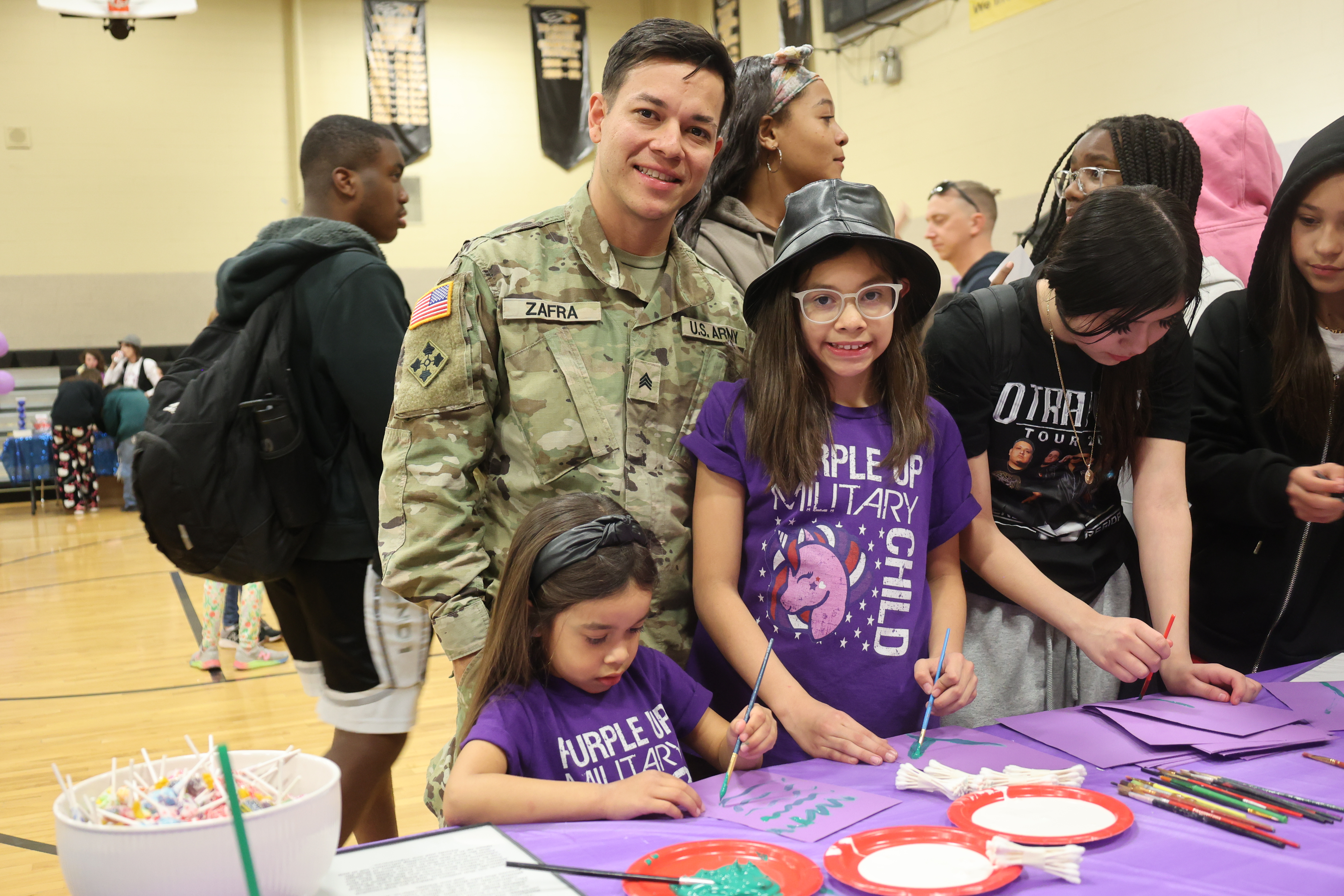 Photo of a military-connected family at an event in a Fountain-Fort Carson school. 