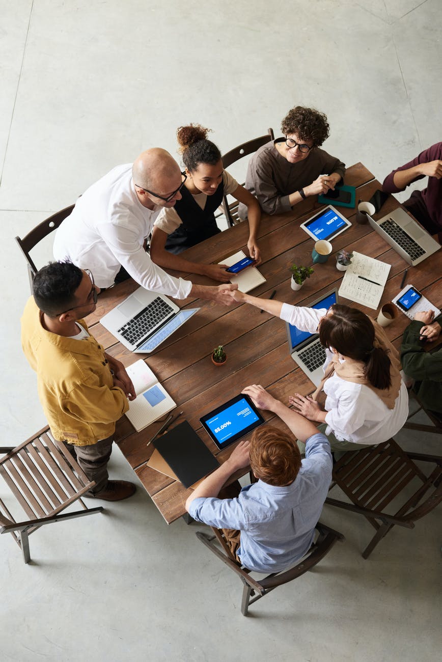 people collaborating over a table 