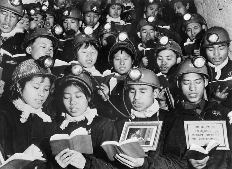 A group of male and female coal miners recite 06 September 1968 in Li Se Yuan mine some paragraphs of Mao Zedong 'Little Red Book' as they celebrate Mao's 'Great Proletarian Cultural Revolution'