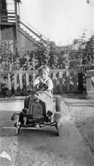 Frank Palmeri Sitting in his Toy Car, circa 1930-1935