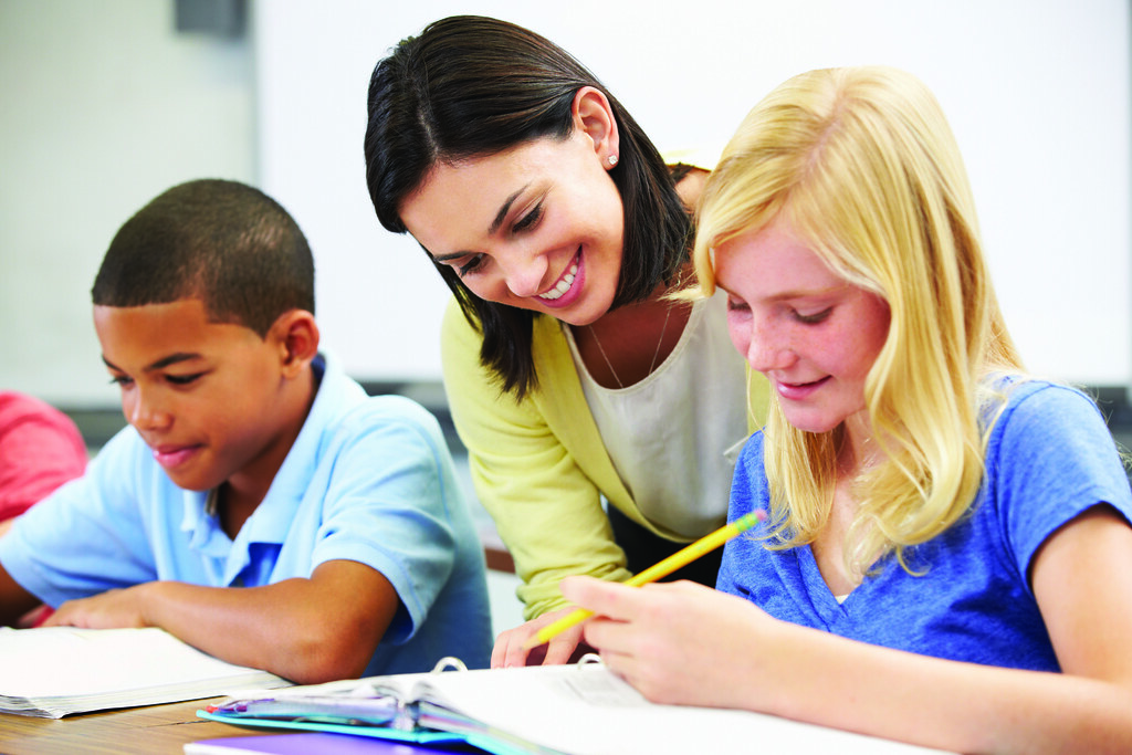 image of teacher with students