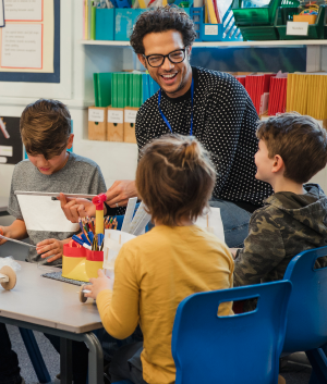 Photo of teacher with students to represent enrollment data for educator preparation programs