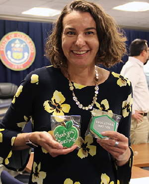 Katy Anthes holding cookies for teacher appreciation