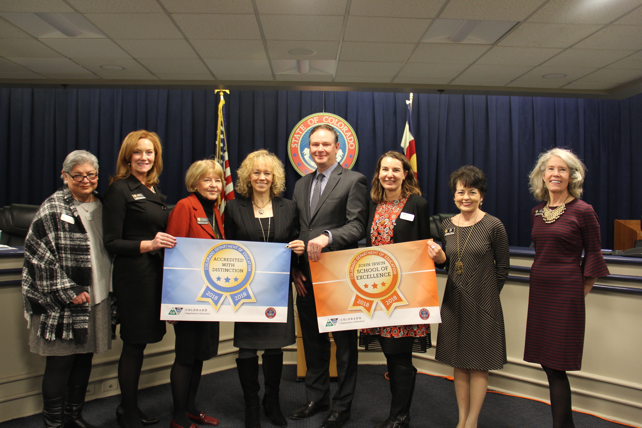 Photo of Commissioner Katy Anthes, state board members Flores, Rankin, Goff, McClellan and Schroeder with Boulder Valley Supt. Rob Anderson and Asst. Supt. Robbyn Fernandez.