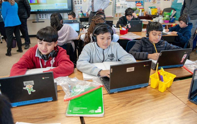 Fifth graders Justin Sauzedo, Abraham Lopez and Mike Sanchez use a math program called Zearn Thursday, Nov. 30, 2023 at Marie Greenwood K-8 in Denver.